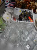 A parcel of various kitchen items including cutlery, drinking glasses etc