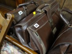 A tan leather vintage doctor's appointment case