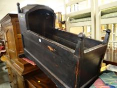 A nineteenth century stained wooden rocking crib