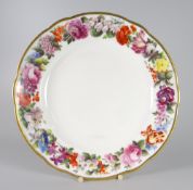 A NANTGARW PORCELAIN FLORAL PLATE DECORATED BY THOMAS PARDOE of lobed form, the border decorated