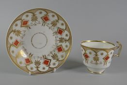 A SWANSEA PORCELAIN COFFEE CUP & SAUCER pattern No.419 with a border of orange diamonds centred with
