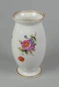 A PORCELAIN BARREL SHAPE VASE attributed to Swansea, decorated with sprays of flowers, 11cms high