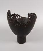 OGWYN DAVIES stoneware - raised bowl of 'burnt form' with hollow-work body, 14cms high Provenance: