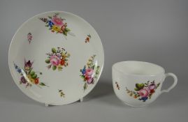 A SWANSEA PORCELAIN COFFEE CUP & SAUCER with ear shaped loop handle, painted with sprays of