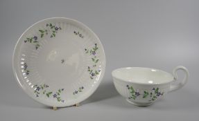 A SWANSEA PORCELAIN PARIS FLUTE BREAKFAST CUP & SAUCER decorated with vines of stylized blue flowers