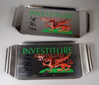 A PAIR OF PAINTED STAINLESS STEEL INVESTITURE TRAYS to commemorate Prince Charles invesiture on July