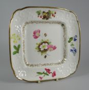 A SWANSEA PORCELAIN SQUARE DISH having a border moulded with scrolls, foliage and ribbons, decorated