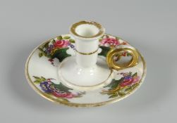 RARE SWANSEA TAPERSTICK with circular stand and cylindrical nozzle, having a gilded ring handle