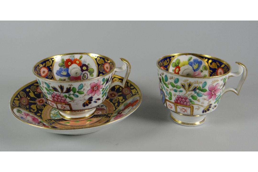 A SWANSEA 'JAPAN' TEA & COFFEE TRIO decorated in the Imari palette with reserves of garden flowers - Image 2 of 3