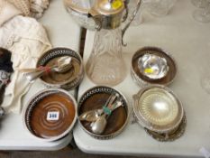 Four good electroplate wine coasters, an etched glass claret jug and similar items