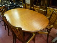 G-Plan stylish oval pull-out dining table on twin supports with six (four plus two) dining chairs