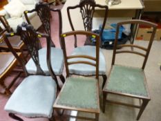 Three blue/grey upholstered bedroom chairs and two other chairs