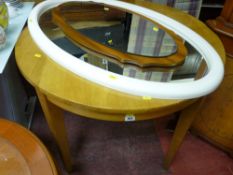 Light wood circular dining table and a white plastic framed mirror and one other