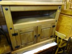 Possibly Mexican pine entertainment unit with two base doors