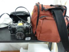 Canon AE1 35mm camera and canvas bag with associated equipment
