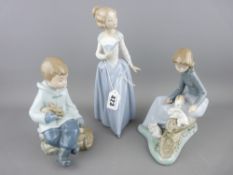 Three Nao porcelain figurines and a USSR model of a ferret