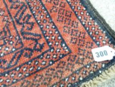 Eastern Balouchi rug, red ground with repeating block central pattern and continuous border