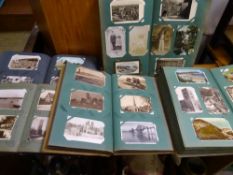 Approximately eight hundred plus vintage postcards contained in five albums