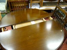 Dark wood extending dining table and set of chairs