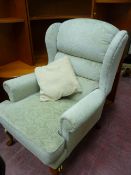 Light upholstered easy chair