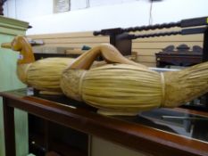 Two wooden and wicker duck ornaments, approximately 50 cms long