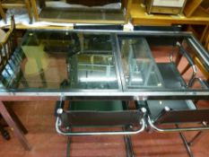 Ultra modern glass and chrome dining table with four chrome framed chairs (one glass missing)