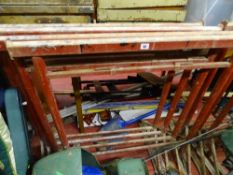 Set of four red scaffold trellises