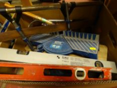 Box of tools including levels, mitre saws etc