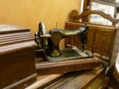 Vintage Singer sewing machine in case and a magazine rack