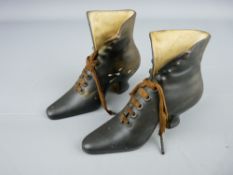 Pair of vintage porcelain boots with laces