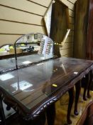 Polished wooden glass topped nest of three tables and a hexagonal shaped mirror