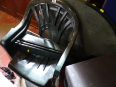 Green plastic garden table and two chairs