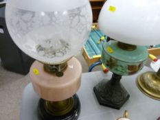 Two Victorian oil lamps with glass fonts and shades