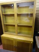 Mid Century light wood glass topped bookcase cupboard with interior adjustable shelves