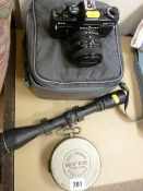 Mikiphone pocket phonograph, a rifle scope and a Praktica SLR camera and accessories in carry case