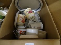 Box of pottery mugs and tableware