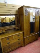 Art Nouveau style two piece bedroom set of mirrored door wardrobe with stylized carved detail and