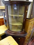 Reproduction mahogany effect corner cabinet, the top with bowed glass door, fabric covered