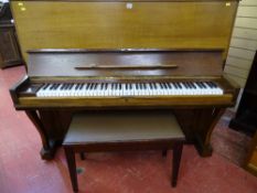 Bechstein oak cased upright piano with a modern mahogany piano stool with music sheet contents