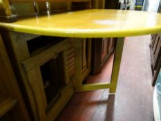 Modern light wood dining table with slide-out chairs