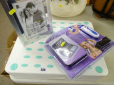 Collapsible bath safety seat, an as new 'Whizz It' lady's manicure set and a modern photograph