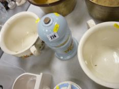 Two vintage chamber pots and a bar pump advertising front for Wrexham lager