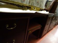 Modern dark wood bedroom suite of dressing table, chest of five drawers and two bedside cabinets