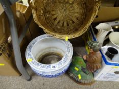 Oriental pottery planter, cast metal doorstop and two wicker baskets