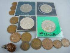 Stanhope lens attached to a natural nut, four commemorative crowns and a small quantity of pre-