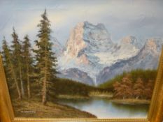 K BOWMAN gilt framed confident modern oil on canvas - snow covered mountainscape with tree lined