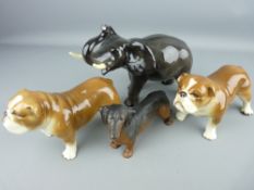Beswick dachshund, two china bulldogs and a Melba ware figure of an elephant