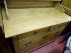 Stripped pine chest of two short over two long drawers with shelf top