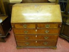 A GEORGIAN OAK BUREAU (alterations), 104.5 cms high, 100 cms wide, 55 cms deep
