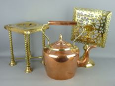 A POLISHED VICTORIAN COPPER KETTLE with acorn lid finial and two pierced brass kettle trivets